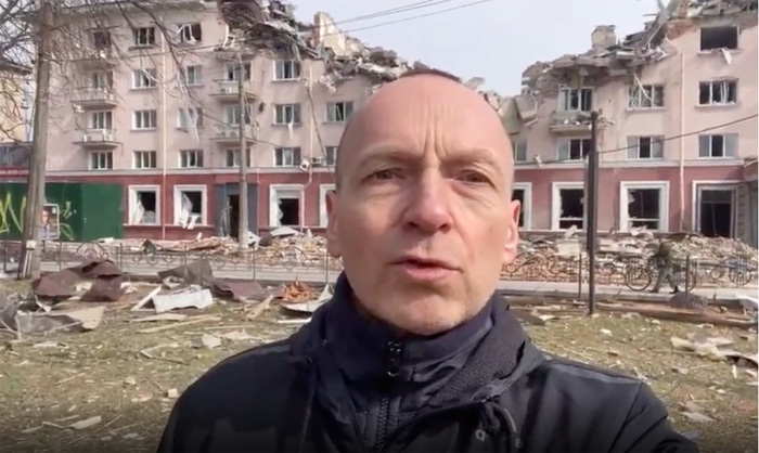 Credit: CNN Photo. Mayor of Chernihiv Vladyslav Atroshenko, in front of the damaged building, talks to CNN on March 30, 2022.
