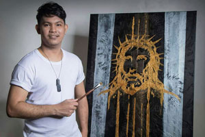 Mario Subeldia, Taiwan’s first Filipino migrant artist, poses with his work. Subeldia left Luzon in the Philippines to work in Taiwan, where he discovered his talent, passion, and future as an artist.