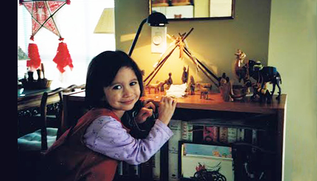 Three -year old Maya “redecorates” the manger with white “blankets”, and says, “Baby Jesus lives in my Grandma’s house.”