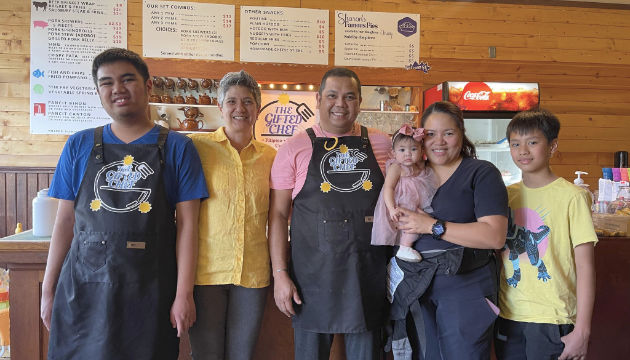 Jayson Alilin and his family at the OK Cafe with Mable Elmore.