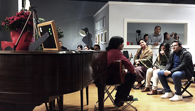 Edgar Avelino playing the guitar at Art Centrum Gallery for A Night of Music Event. Photo courtesy of Melissa Remulla-Briones.